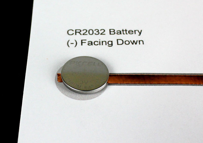 attach coin cell battery to template